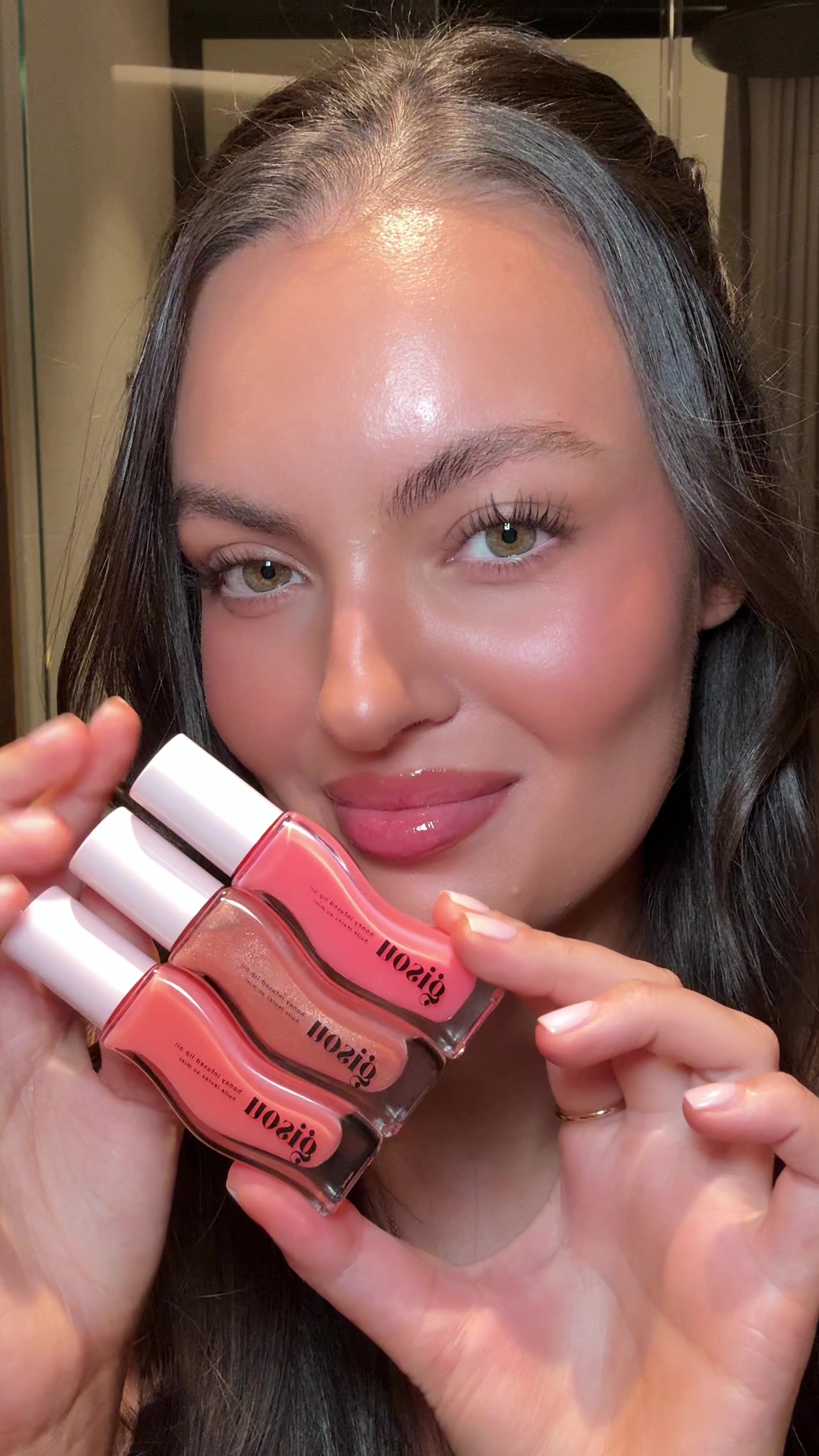 TikTok post by @caressmd for Gisou. Caption reads: [...] plum though 🤩 trying the new shades of....