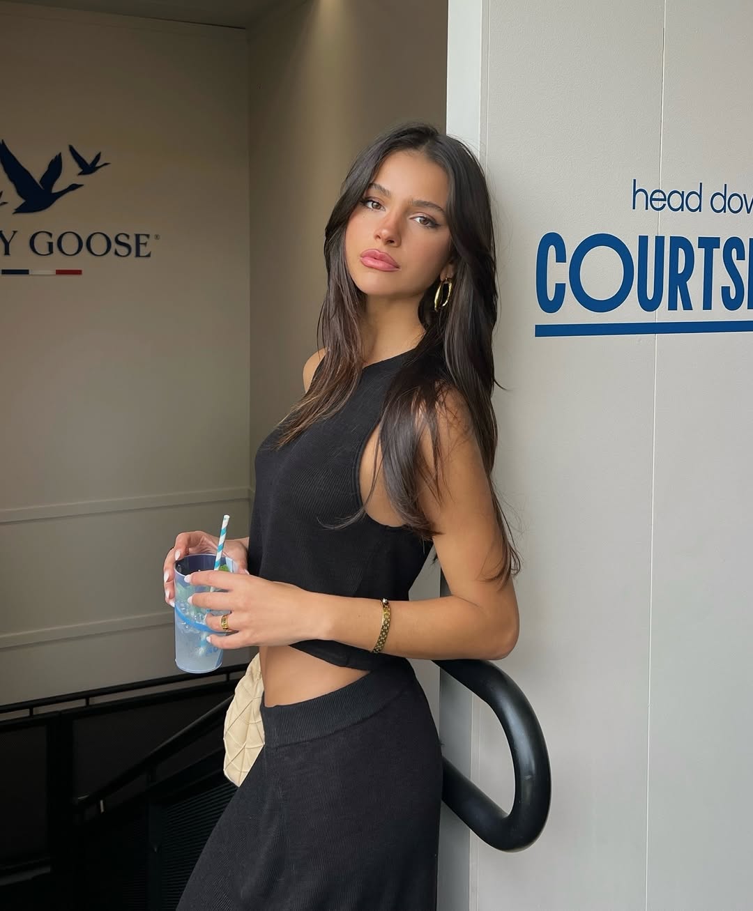 Instagram post by @oliviagrivas for Grey Goose. Caption reads: a day at the tennis w/ @greygoose & their lemon....