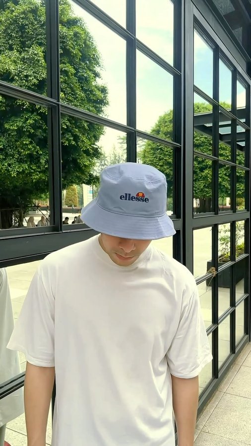 Instagram post by @gustypratama for ellesse. Caption reads: Casual stroll in my @ellesse outfits. Comfort....