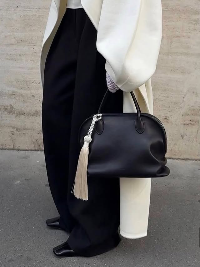 Instagram post by @whereiskhatia for Mytheresa. Caption reads: @mytheresa.com presents a study in modern [...].