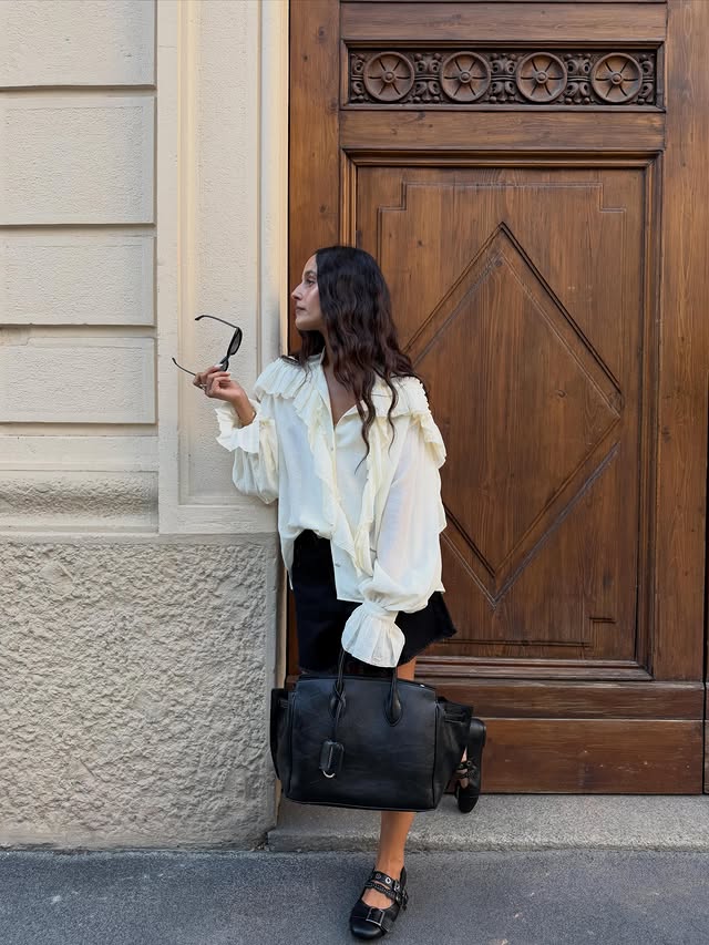 Instagram post by @sarahbrezel for CHARLES & KEITH. Caption reads: [...] 🤍 bag, shoes and sunglasses by....