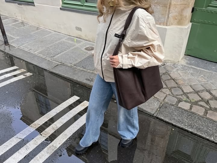Instagram post by @hannah.ry for Vivi Mari. Caption reads: rainy days in paris @vivimariofficial This jacket....