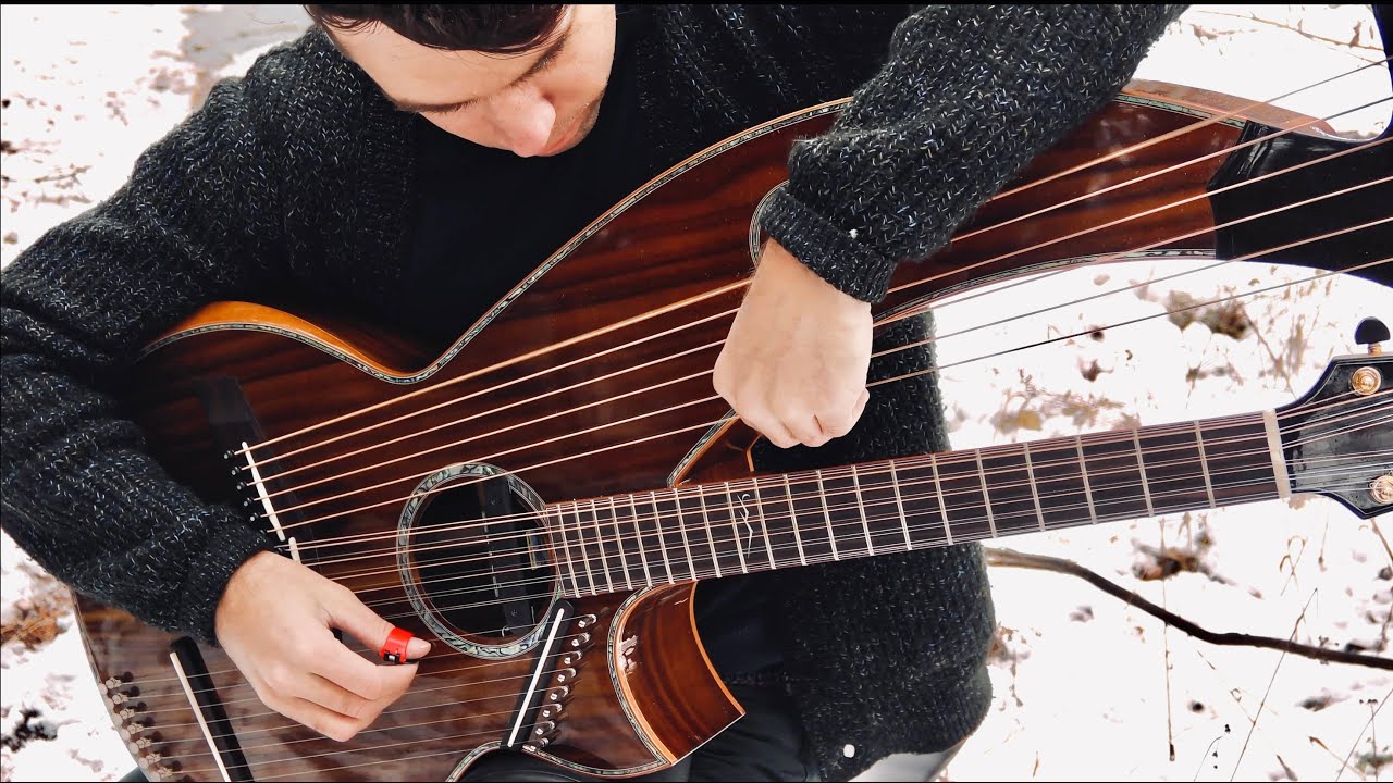YouTube post by @JamieDupuisMusician for OBSBOT. Caption reads: Carol of the Bells - 26 String Harp Guitar....