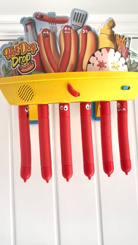 Instagram post by @mumma_andher_minis for Smyths Toys Superstores. Caption reads: 🌭 Hotdog Drop 🌭 We have had so much fun over the....