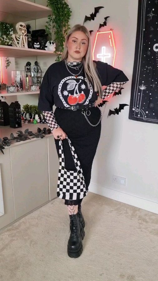 Instagram post by @laurageorge.x for Hell Babes. Caption reads: [...] tee kindly sent from the lovely @hellbabes....