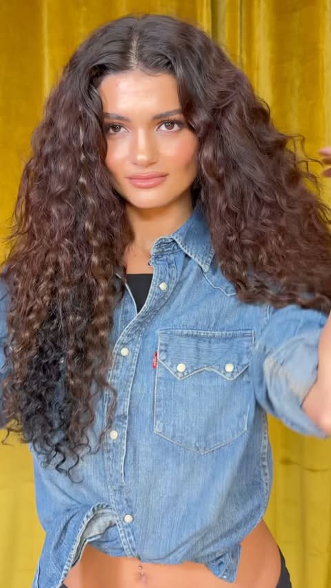 Instagram post by @castillo_13 for Donna Bella Hair. Caption reads: [...] Kera-Link Curly Extensions from....