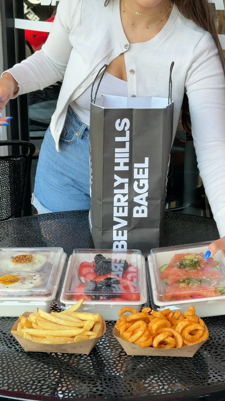 Instagram post by @beverlyhillsbagel for Eater LA. Caption reads: 🥯 Our open faced bagels are one of a kind 👌🏽....