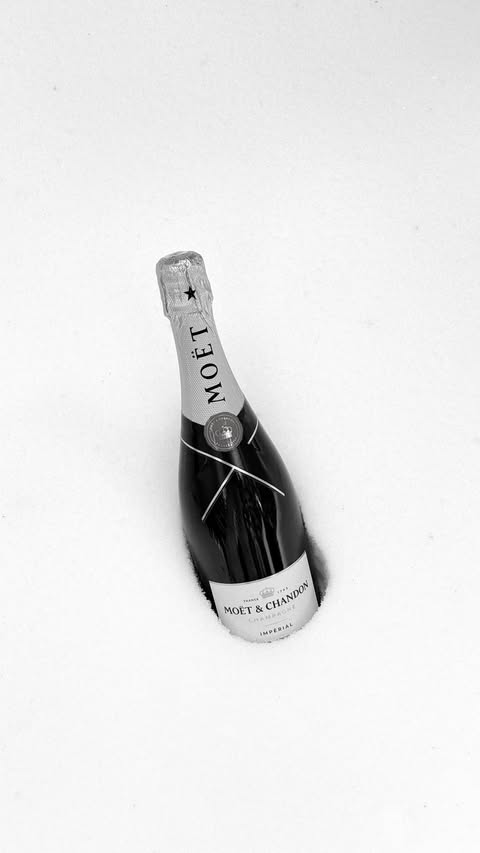 Instagram post by @mar.ie.claire for Moët & Chandon. Caption reads: Only thing more dramatic than the volcano behind....