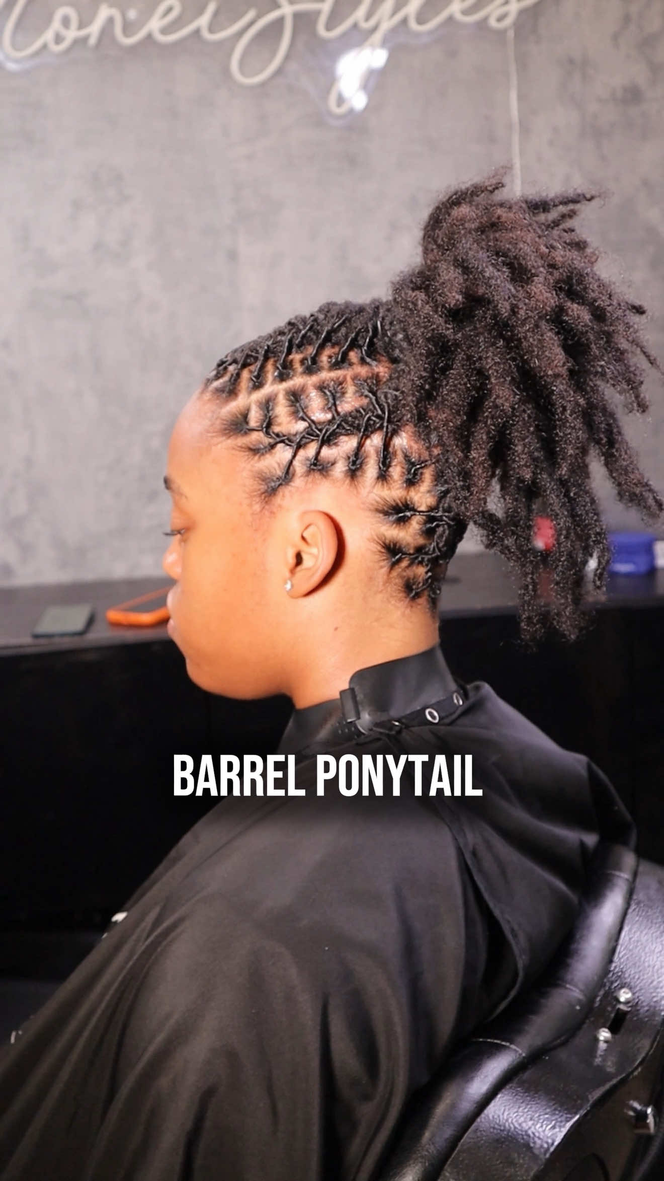 TikTok post by @caymoneistyles for Cécred. Caption reads: Barrel Ponytail on a Year Old Locs Use code:....