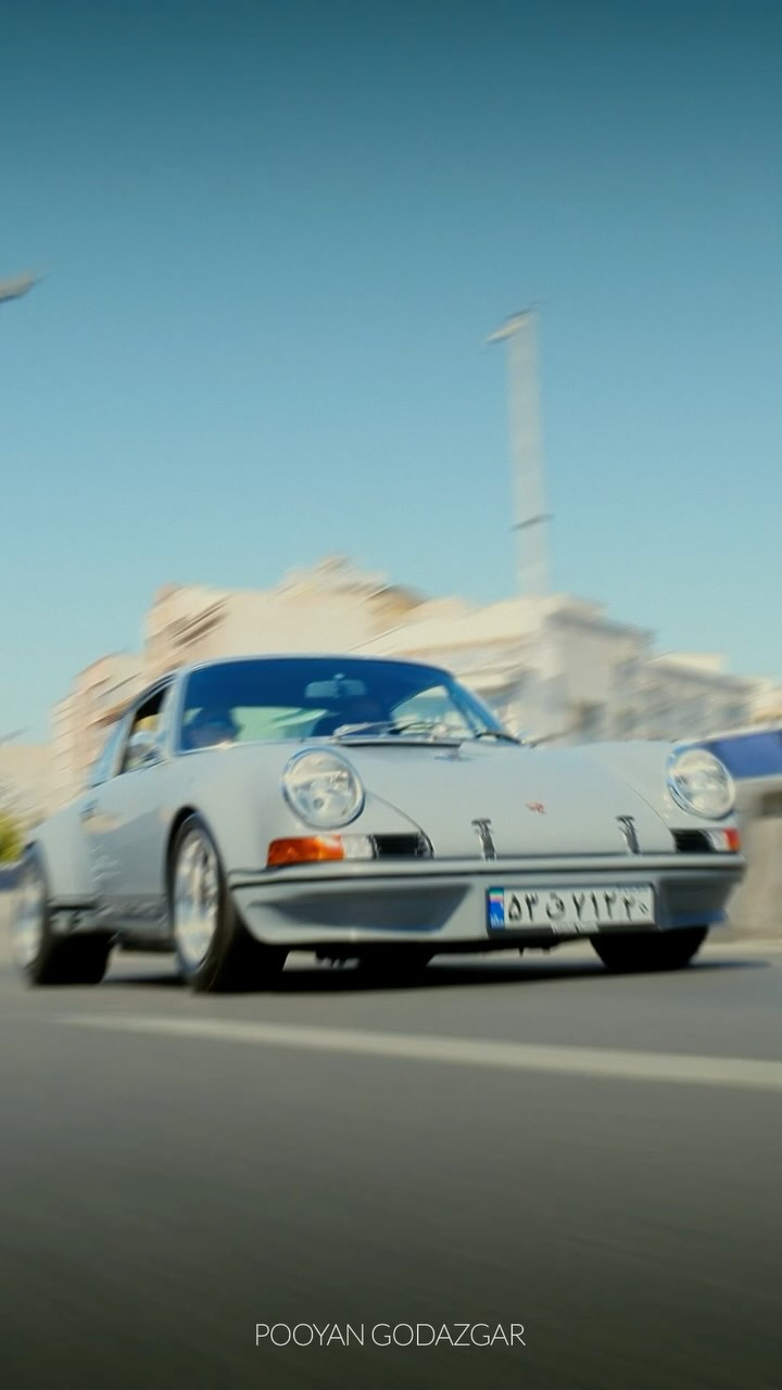 Instagram post by @pooyangodazgar for Porsche. Caption reads: Porsche 911 RS 🇩🇪
.
با اینکه دوس داشتم از صدای....