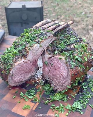 Instagram post by @hablemosdevino.cl for New West KnifeWorks. Caption reads: Herb Garlic Pepper Crusted Baked Rack of Lamb on....