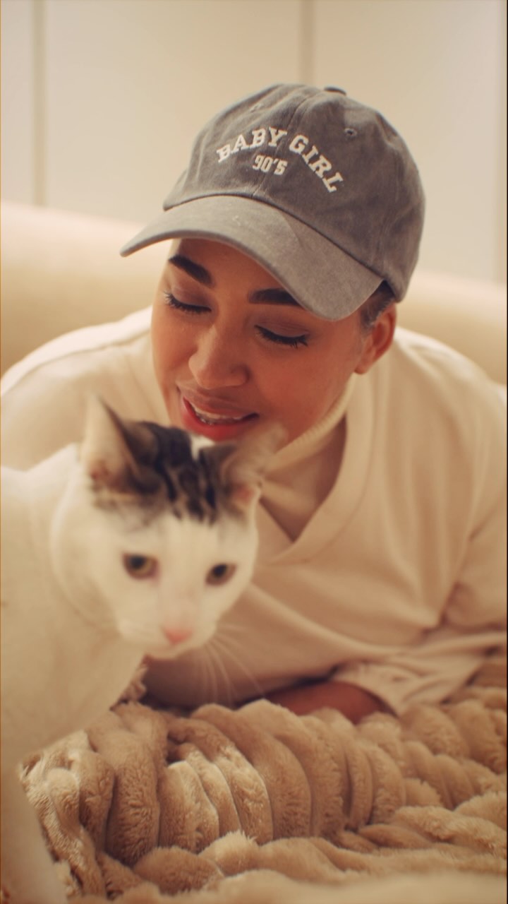 Instagram post by @rasheeqah_karriem for All Good. Caption reads: If cuddles were an Olympic sport, my cat would be....