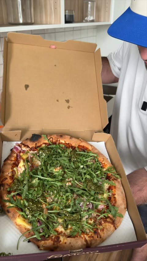Instagram post by @tybridgwater for SkipTheDishes. Caption reads: Never a bad day when you can get @famosopizzeria....