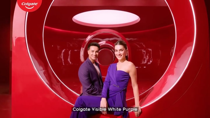 Instagram post by @kritisanon for Colgate. Caption reads: [...] skin, but for your smile. It’s Purple!....