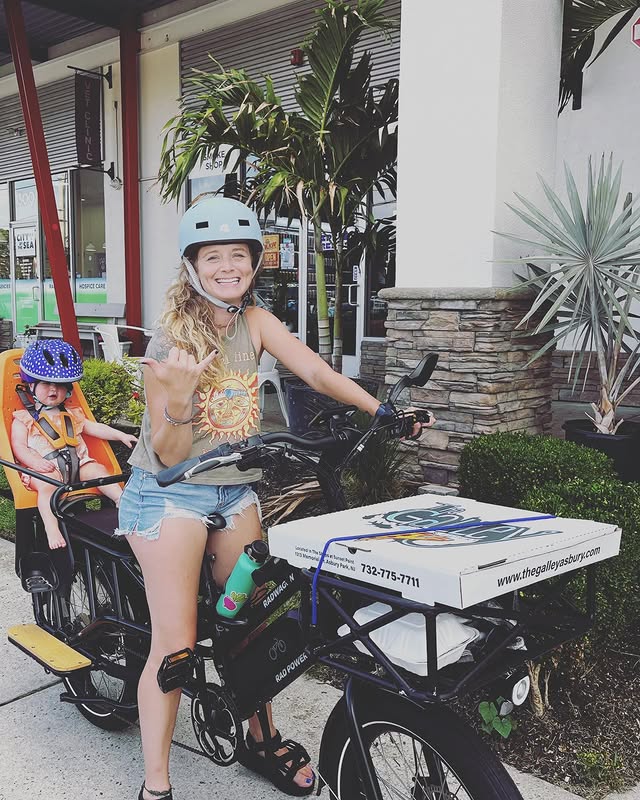 Instagram post by @tinabock for Rad Power Bikes. Caption reads: Jersey shore summer dump sponsored by pizza and....