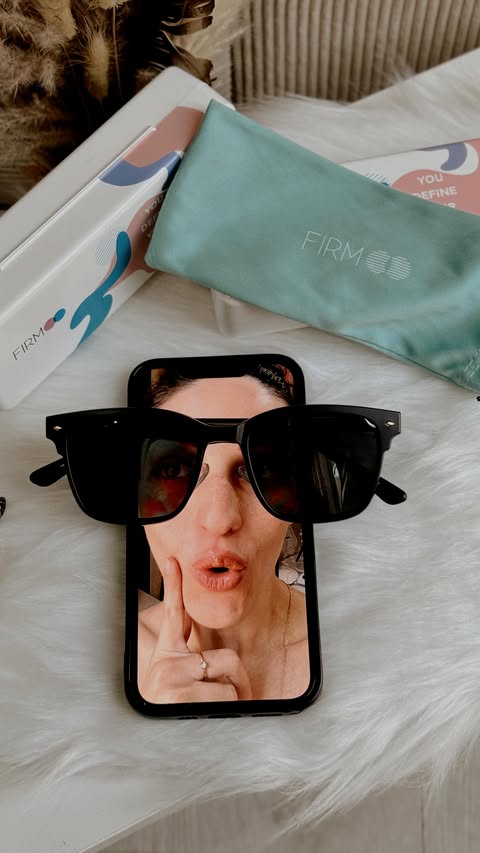 Instagram post by @ugcwithsofii for Firmoo.com. Caption reads: A good pair of sunglasses can change your whole....