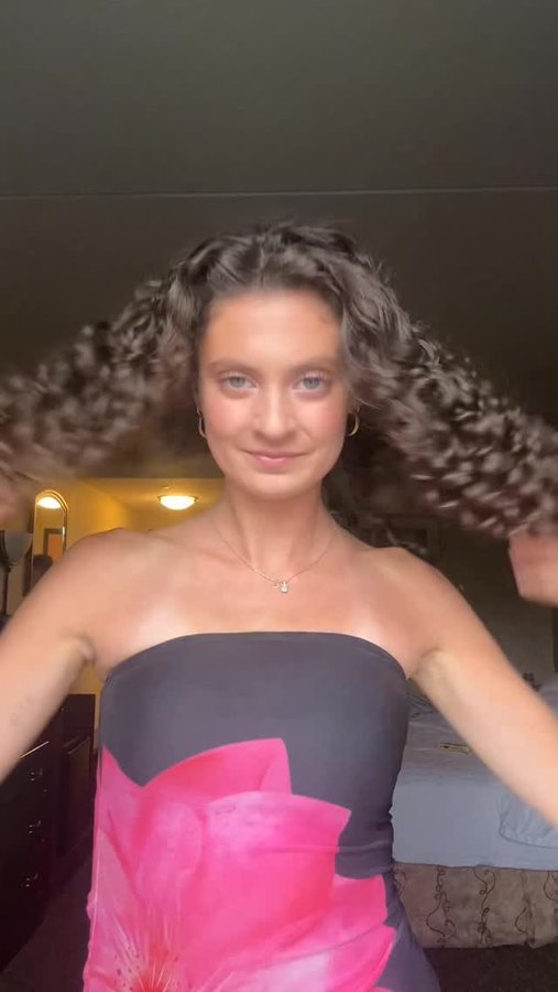 Instagram post by @julesdell_ for UMBERTO GIANNINI. Caption reads: feels like an intro to my account 🥹 #curlyhair....