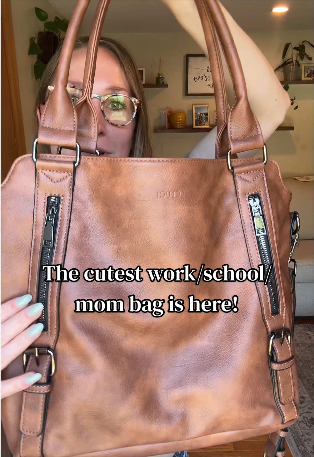 TikTok post by @a_rae_shines for CLUCI. Caption reads: [...] #workessentials #bagtok #dealsforyoudays....
