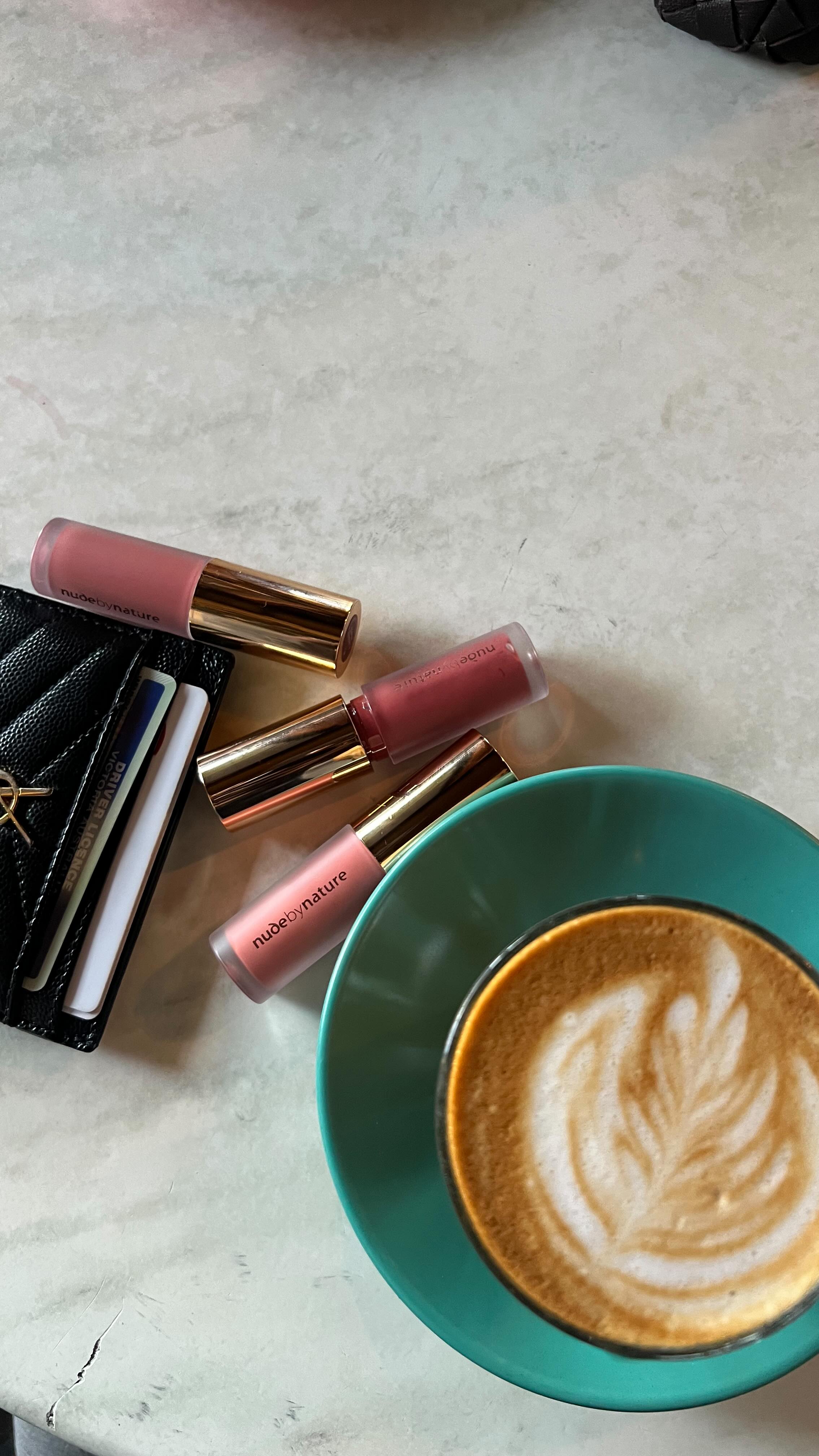 Instagram post by @winnniy for Nude by Nature. Caption reads: Juicy lips, clean beauty 💋 Swipe, shine & go with....