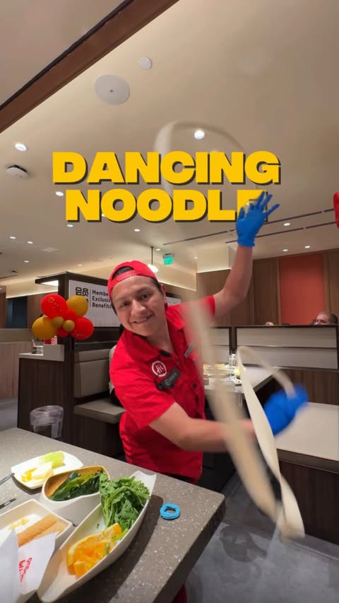 Instagram post by @snackinslouie for Haidilao US. Caption reads: Haidilao really said dinner AND a show 😂🍜🔥From....