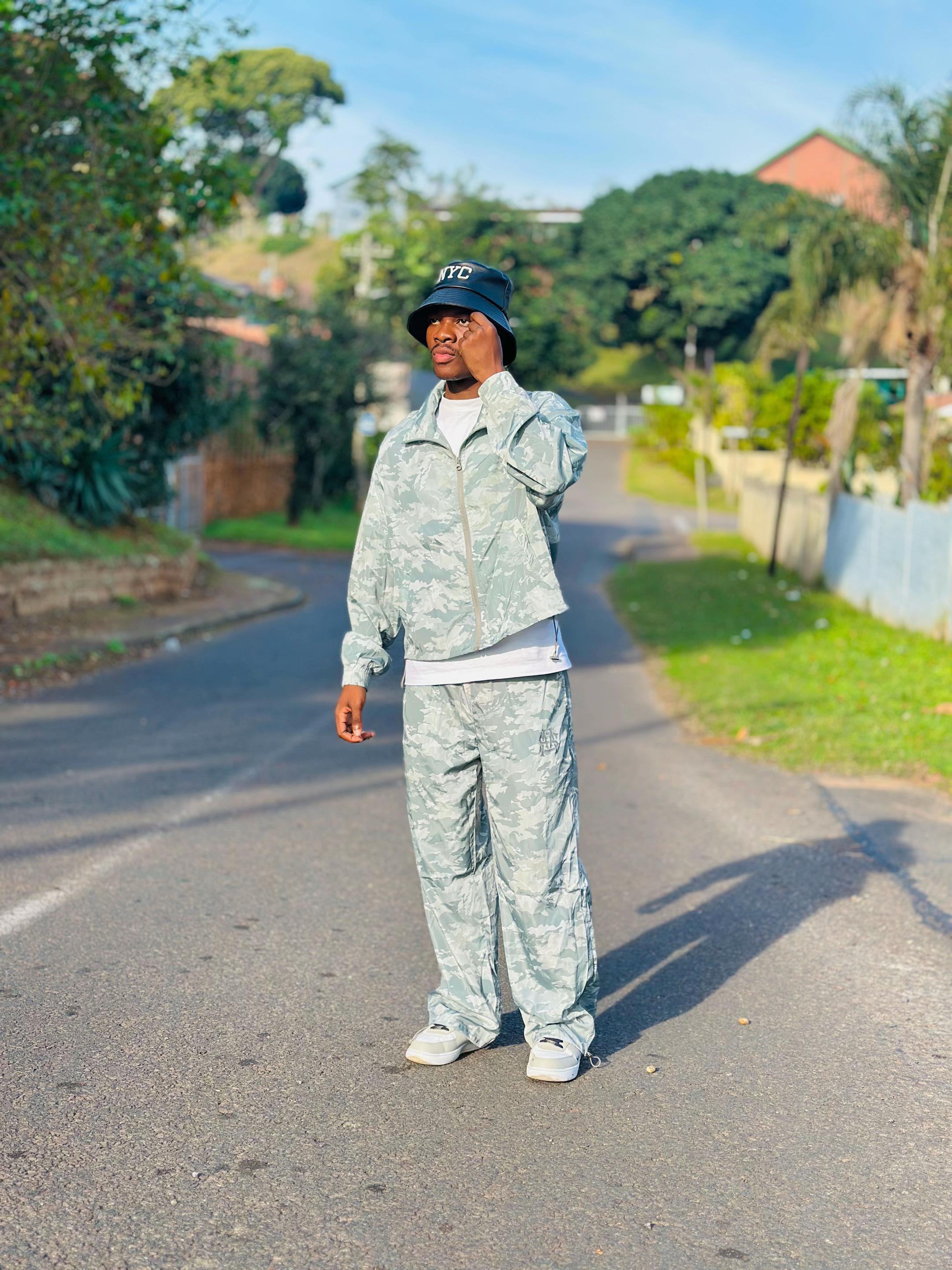 TikTok post by @famous_lungelo_official for SHEIN MEN. Caption reads: [...] @SHEIN @SHEIN ZA @SHEIN MEN #SHEINtrends....