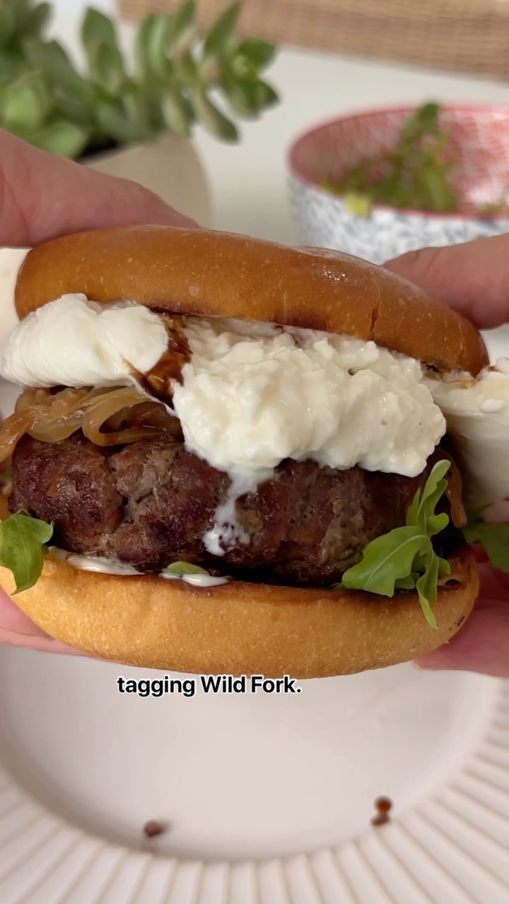 Instagram post by @behappyfoodie for Wild Fork Foods. Caption reads: This is not your average burger 🍑🔥
I grilled up....