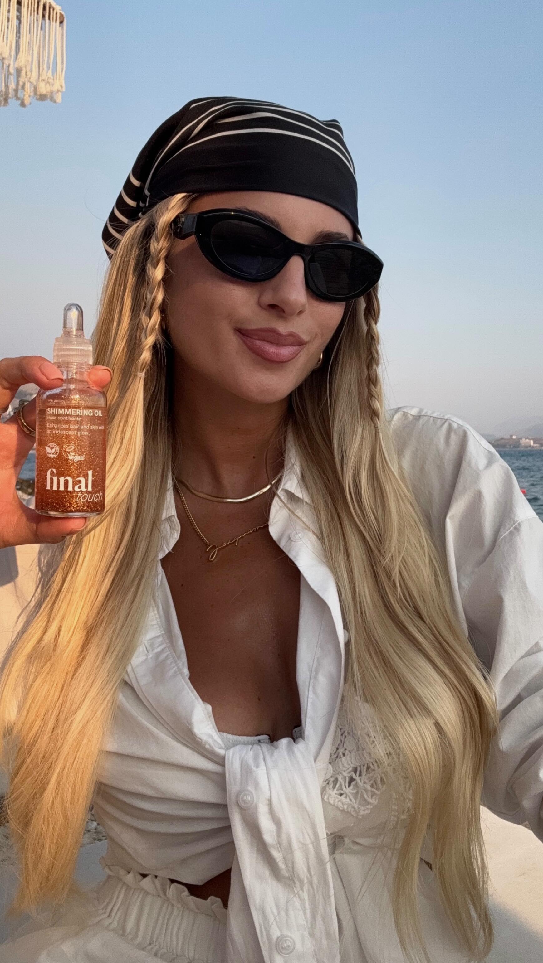 Instagram post by @arinars for Hairlust. Caption reads: bandana hack on the beach with @hairlust 🏖️🥥🌺....