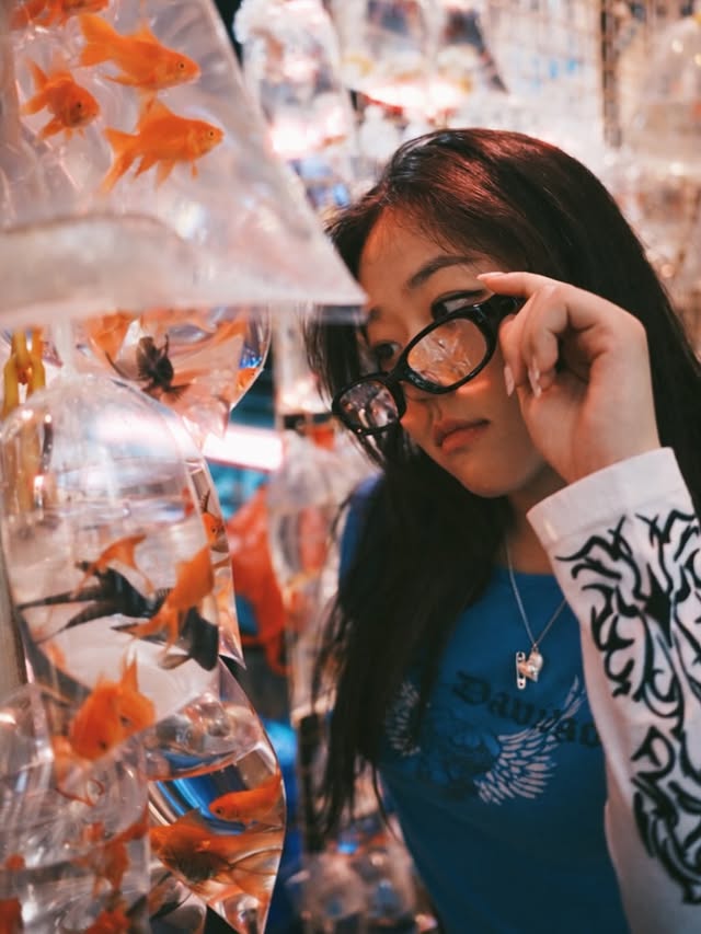 Instagram post by @jiny.maeng for Discover Hong Kong. Caption reads: This was my first time exploring Hong Kong as an....