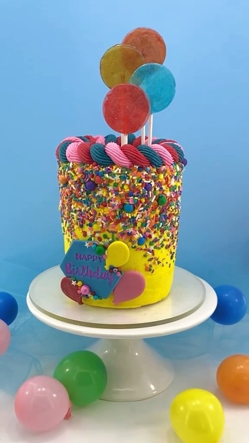 Instagram post by @erin.cakesandcupcakes for Chefmaster. Caption reads: 🍭 Bright, colorful lollipops are super easy with....