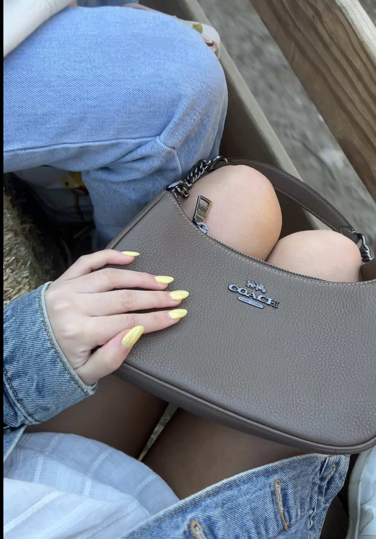 TikTok post by @rxyejin for Coach. Caption reads: The perfect bag to take with me everywhere this....