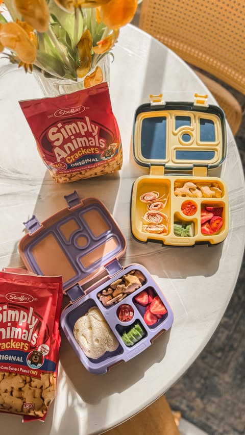Instagram post by an influencer for BabbleBoxx. Caption reads: Lunch pack prep with @simplyanimalssnacks 🐪🦏#ad....