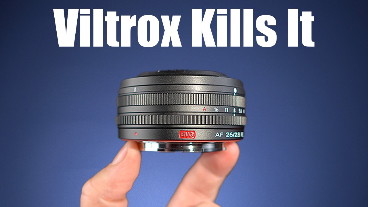 YouTube post by @MarkBennettCameraCrisis for Viltrox. Caption reads: [...] Amazon: (amazon affiliate paid link) Viltrox....
