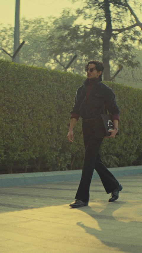 Instagram post by @mencrucials for The Collective. Caption reads: Layers that feel warm, look sharp, and carry you....