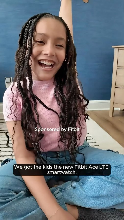 Instagram post by @team2moms for Fitbit. Caption reads: [...] approaching, we got our kids the new @fitbit....