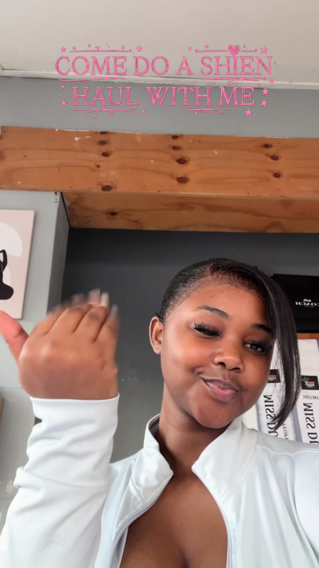 TikTok post by @ladyjohns_ for VARSITIE. Caption reads: SHEIN Fit Check Challenge! Search EM7YL on SHEIN....