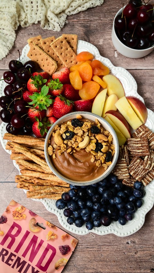 Instagram post by @leeksnbeets for RIND Snacks. Caption reads: [...] DOUGH DESSERT HUMMUS BOARD FEATURING....