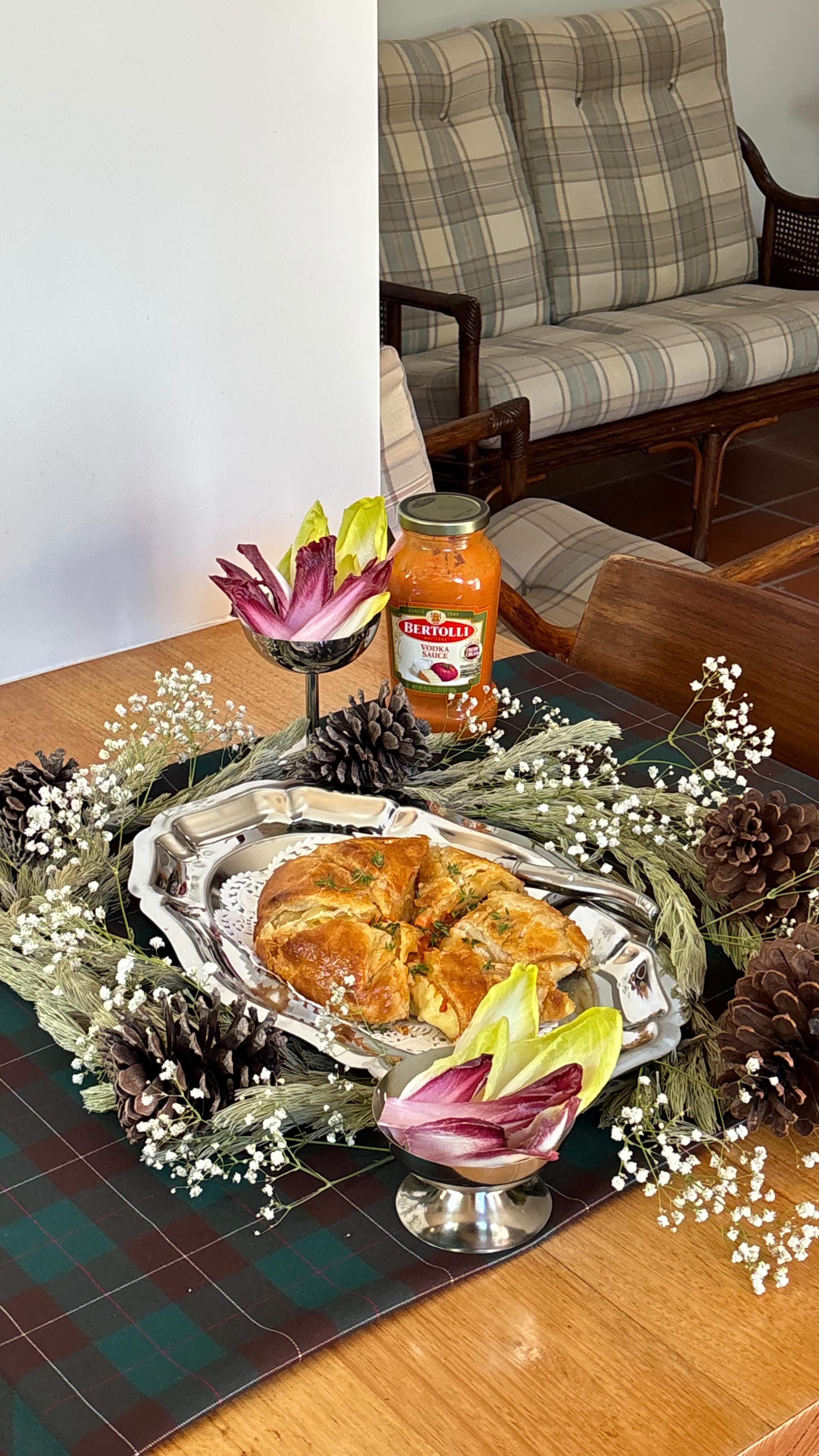 Instagram post by @jennys__table for Bertolli. Caption reads: #ad brie en croute with @bertolli_us ‘Vodka Sauce’....