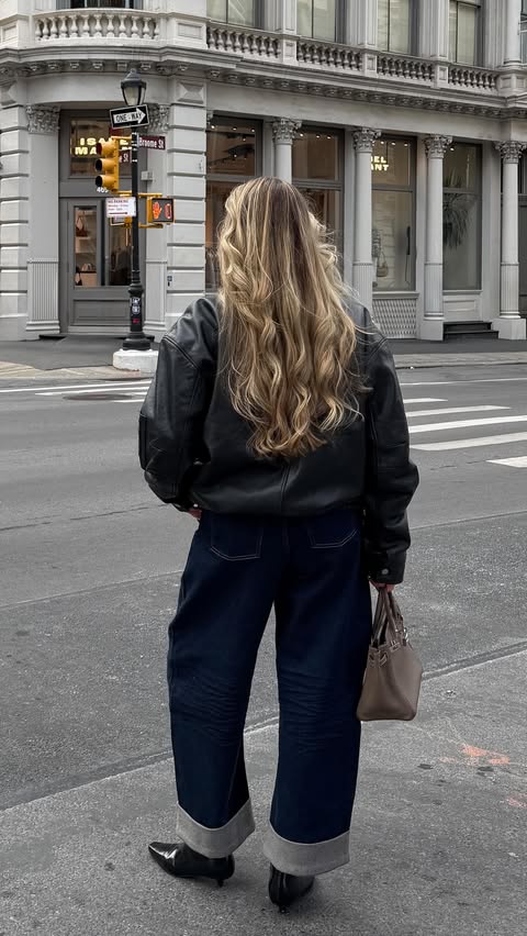 Instagram post by @itiscarine for SPANX. Caption reads: currently living in these barrel jeans @spanx....