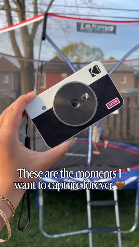 Instagram post by @thatcurlyhairmom for Kodak Photo Printer. Caption reads: [...] moments with the @kodakphotoprinter_ca....