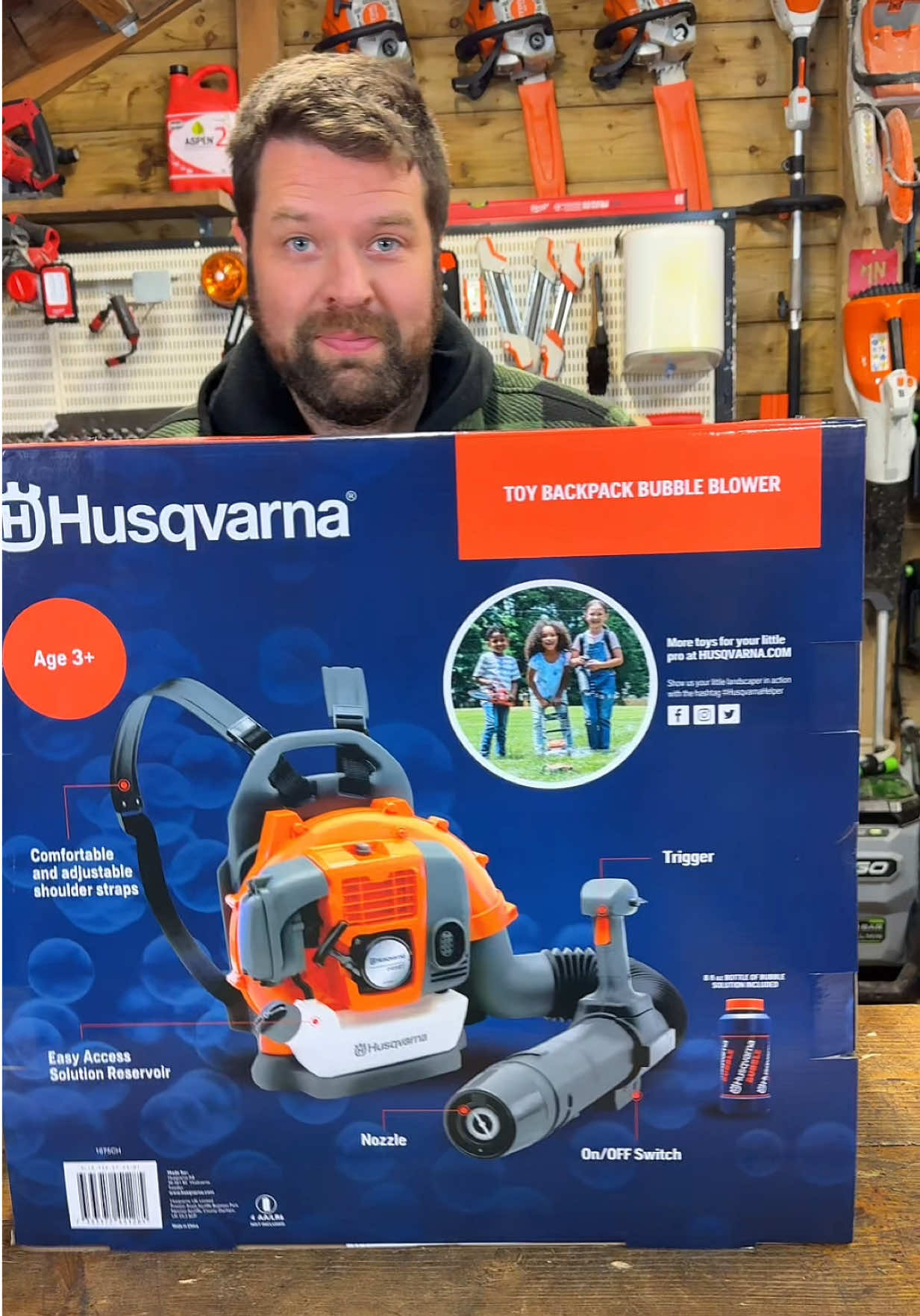 TikTok post by @machinerynation for Husqvarna. Caption reads: Christmas gift ideas unboxing Husqvarna toy 345BT....
