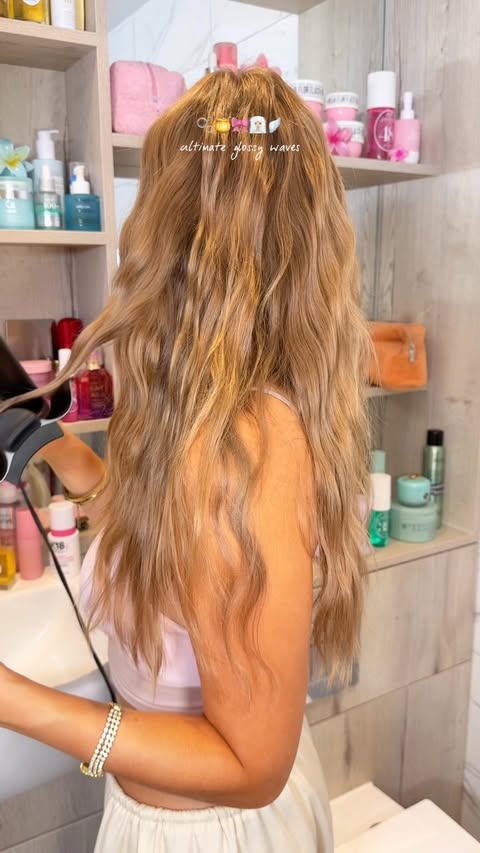 Instagram post by @byemmaleah for OUAI. Caption reads: [...] off* @tangleteezer detangler brush* @theouai....