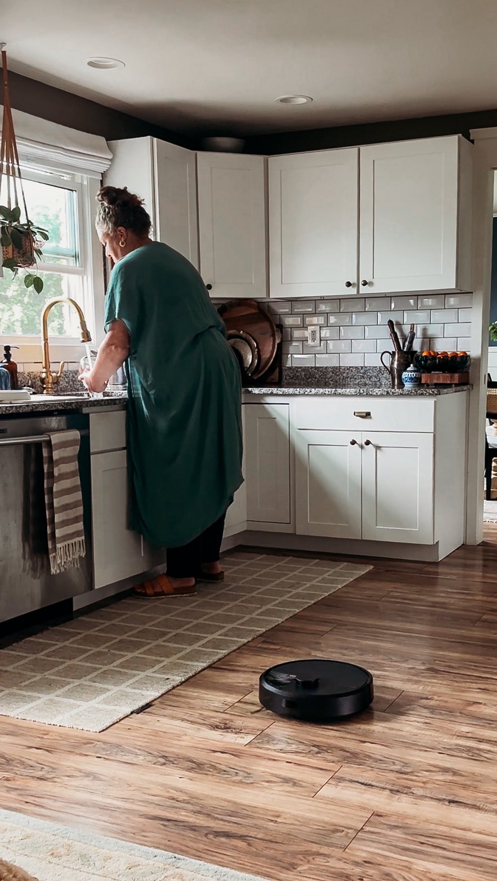 Instagram post by @therurallegend for iRobot. Caption reads: sponsored  My new assistant could wipe the floor....