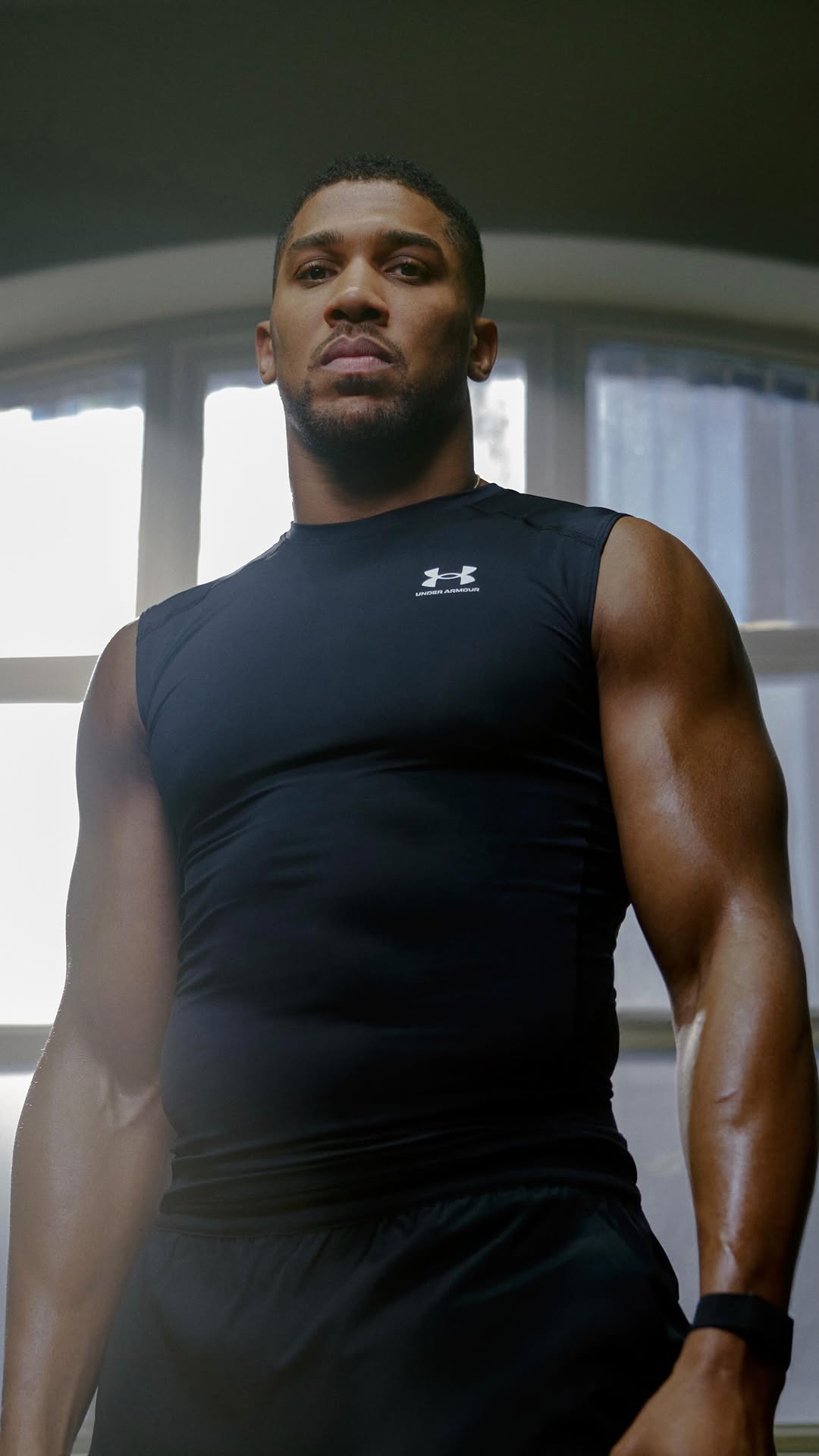 Instagram post by @anthonyjoshua for Under Armour. Caption reads: Ch. 5 🎬 Live your truth, come rain or shine..