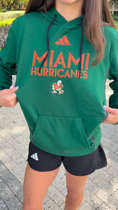 Instagram post by @maddiescheier for adidas. Caption reads: [...] the link in my bio to rep the canes🧡🏈....