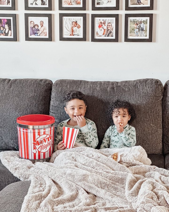Instagram post by @_kaitlyntucker for The Popcorn Factory. Caption reads: #AD PJs, movies & @popcornfactory 🍿
•
We are....