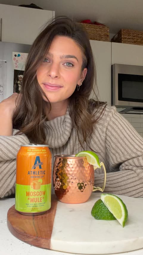 Instagram post by @anniejorgensen for Athletic Brewing. Caption reads: [...] Cheers to Athletic January 🍻....