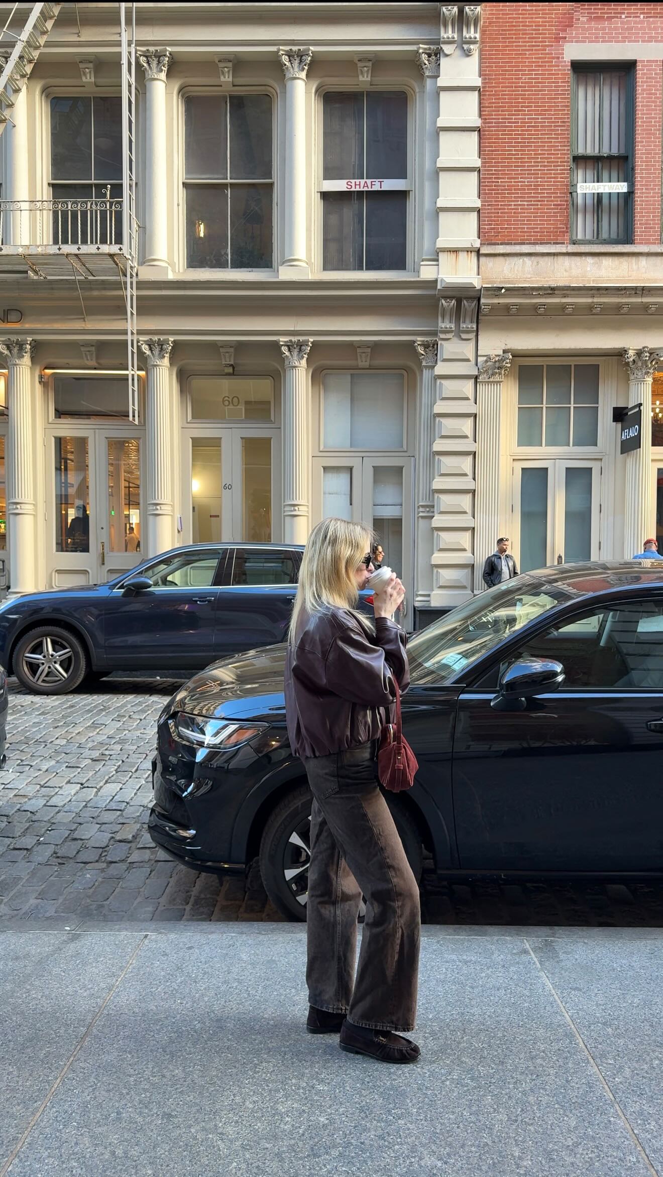 Instagram post by @viktoria_myr for Fabrique. Caption reads: Slow fall mornings in SoHo ☕️🍂 in one of my....