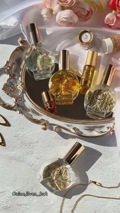 Instagram post by @nine.lives_kat for The Sage Lifestyle. Caption reads: Gemstone Perfumes✨ #giftedbythesagelifestyle

Do....