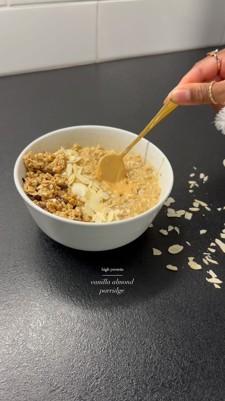 Instagram post by @_foodbyk for Protein World. Caption reads: High protein porridge 🤍✨

Super easy and....