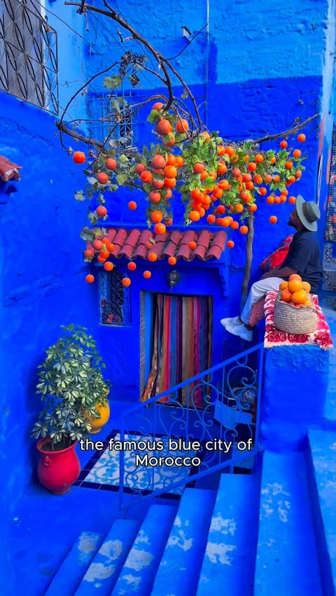 Instagram post by @butnomatter.theroadislife for Holafly. Caption reads: Exploring Chefchaouen, the famous blue city of....